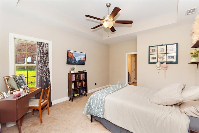 3028 Honeysuckle Dr, Spring Hill, TN 37174 - bedroom with light colored carpet, an office area, a tray ceiling, and a ceiling fan