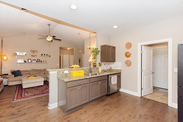 3028 Honeysuckle Dr, Spring Hill, TN 37174 - kitchen with stainless steel dishwasher, a peninsula, wood finished floors, a ceiling fan, and lofted ceiling