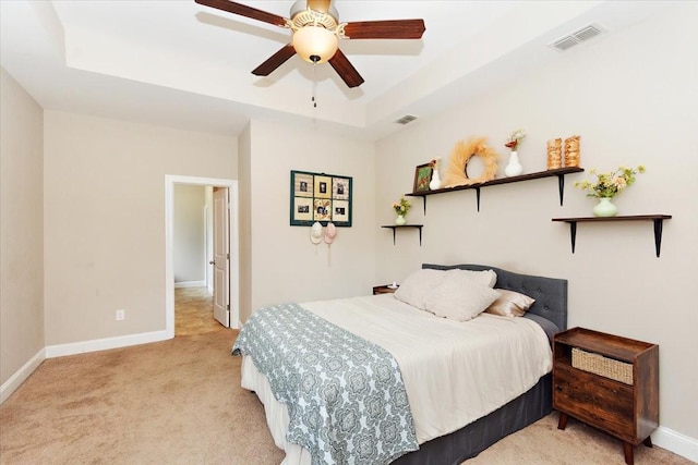 3028 Honeysuckle Dr, Spring Hill, TN 37174 - bedroom featuring light carpet, a raised ceiling, and a ceiling fan