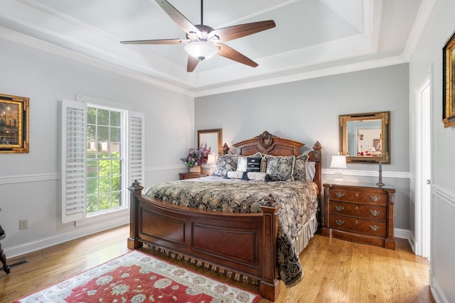 2208 Chadwick Ct, Mount Juliet, TN 37122 - bedroom featuring a raised ceiling, light wood-style floors, ceiling fan, and ornamental molding