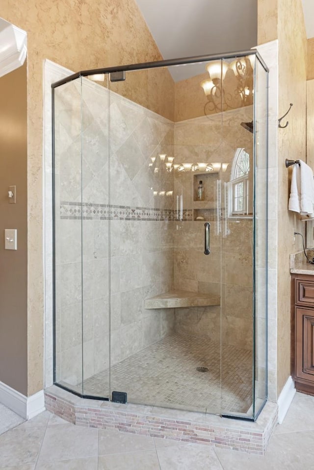 2208 Chadwick Ct, Mount Juliet, TN 37122 - full bath featuring a shower stall, vanity, tile patterned flooring, and vaulted ceiling