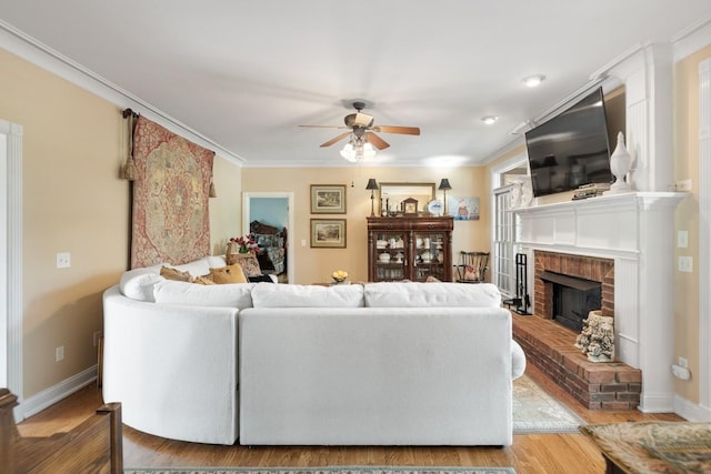 2208 Chadwick Ct, Mount Juliet, TN 37122 - living area featuring ceiling fan, crown molding, wood finished floors, and a brick fireplace