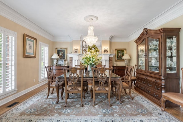 2208 Chadwick Ct, Mount Juliet, TN 37122 - dining space featuring wood finished floors, a chandelier, and crown molding