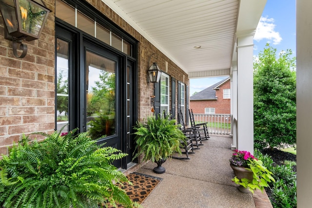 368 Pennystone Cir, Franklin, TN 37067 - property entrance featuring covered porch and brick siding