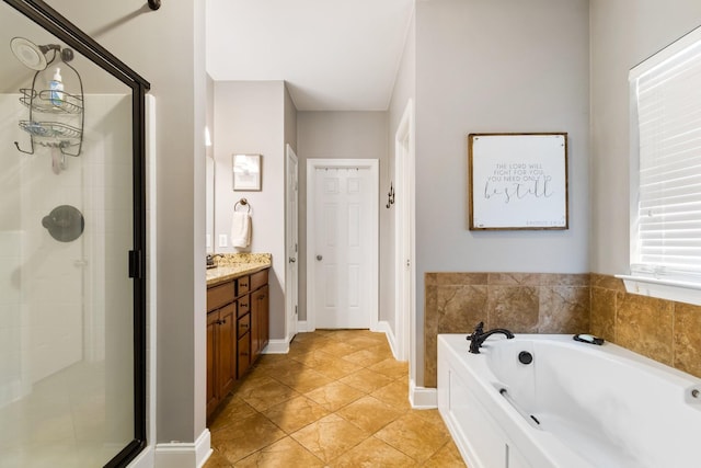 368 Pennystone Cir, Franklin, TN 37067 - bathroom featuring a shower stall, a garden tub, vanity, and tile patterned flooring