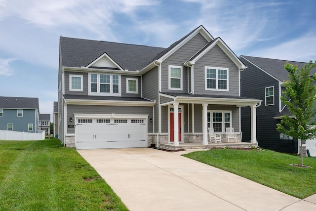 1401 Kennebec Dr, Smyrna, TN 37167 - view of front of house featuring covered porch, a garage, concrete driveway, a front lawn, and stone siding