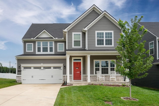 1401 Kennebec Dr, Smyrna, TN 37167 - craftsman inspired home featuring a porch, stone siding, a garage, concrete driveway, and a front lawn