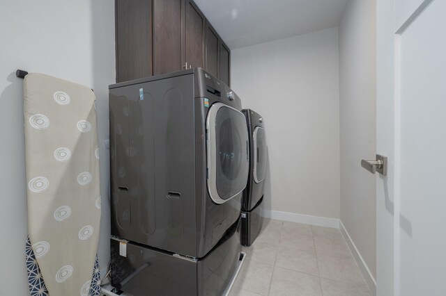 1401 Kennebec Dr, Smyrna, TN 37167 - laundry room featuring cabinet space, independent washer and dryer, and light tile patterned flooring