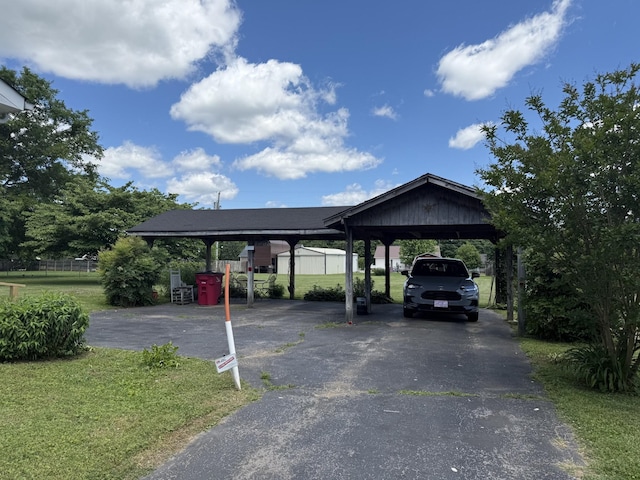242 Kay Cir, Lafayette, TN 37083 - view of vehicle parking featuring driveway and a detached carport