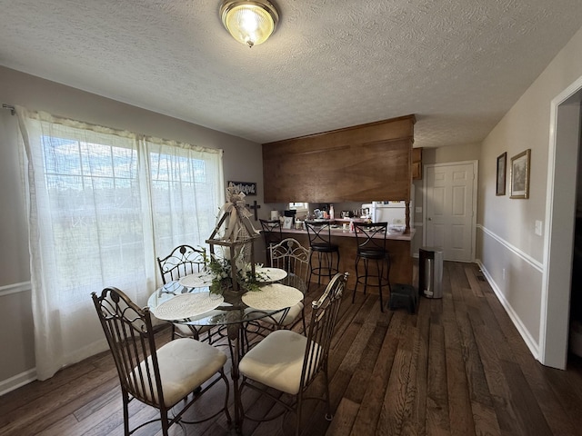 242 Kay Cir, Lafayette, TN 37083 - dining area featuring dark wood-style floors and a textured ceiling
