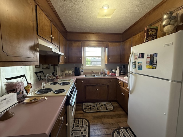 242 Kay Cir, Lafayette, TN 37083 - kitchen featuring freestanding refrigerator, under cabinet range hood, dark wood-type flooring, range with electric cooktop, and a textured ceiling