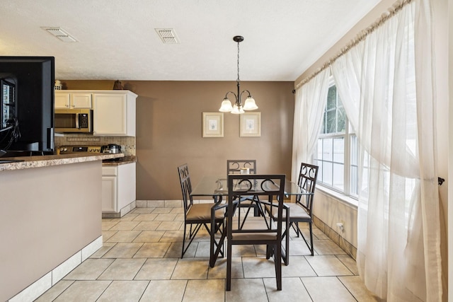 1652 Saint Andrews Dr, Murfreesboro, TN 37128 - dining room with light tile patterned flooring and a chandelier
