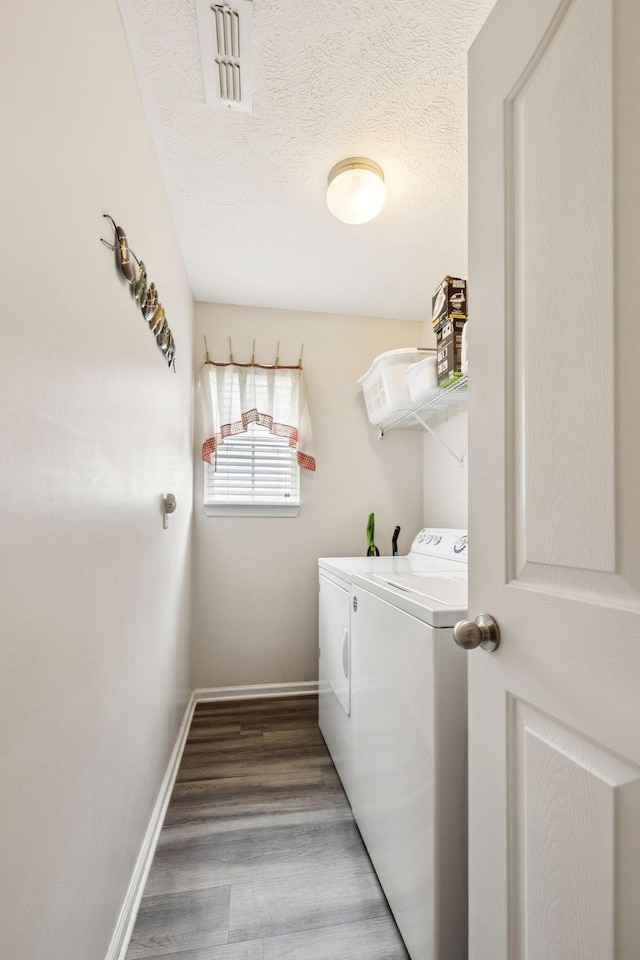 1652 Saint Andrews Dr, Murfreesboro, TN 37128 - washroom featuring washer and dryer, wood finished floors, and a textured ceiling