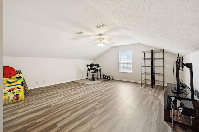 1652 Saint Andrews Dr, Murfreesboro, TN 37128 - game room featuring wood finished floors, a ceiling fan, vaulted ceiling, and a textured ceiling