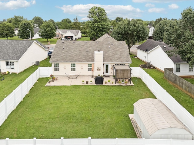 1652 Saint Andrews Dr, Murfreesboro, TN 37128 - back of property featuring a patio, a fenced backyard, a chimney, and a shingled roof
