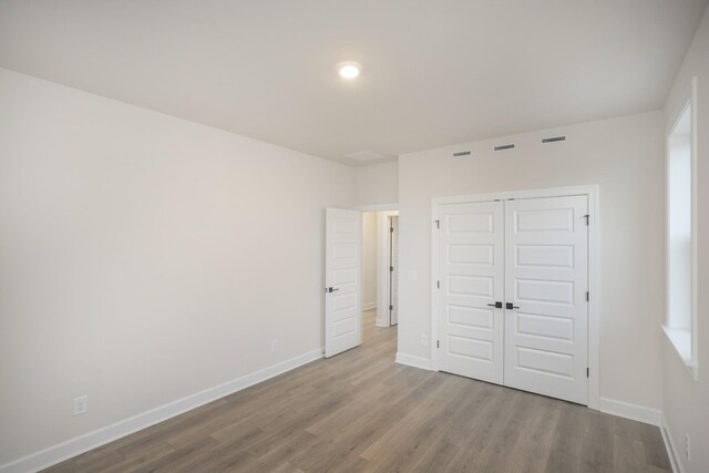 3294 Camden Ct, Mount Juliet, TN 37122 - unfurnished bedroom with wood finished floors and a closet