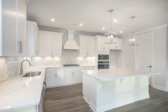 3294 Camden Ct, Mount Juliet, TN 37122 - kitchen featuring built in microwave, premium range hood, oven, tasteful backsplash, and a kitchen island