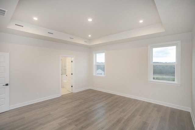 3294 Camden Ct, Mount Juliet, TN 37122 - spare room featuring a tray ceiling, wood finished floors, and recessed lighting