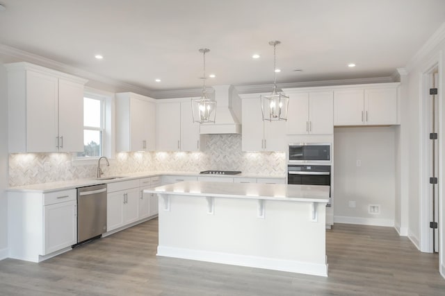 3294 Camden Ct, Mount Juliet, TN 37122 - kitchen featuring stainless steel appliances, custom range hood, a center island, white cabinets, and ornamental molding
