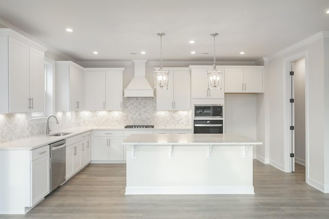 3294 Camden Ct, Mount Juliet, TN 37122 - kitchen featuring stainless steel appliances, premium range hood, ornamental molding, white cabinets, and a center island