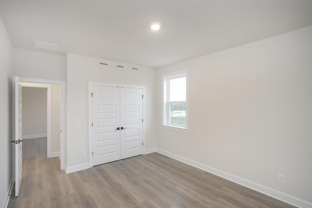 3294 Camden Ct, Mount Juliet, TN 37122 - unfurnished bedroom featuring wood finished floors and a closet