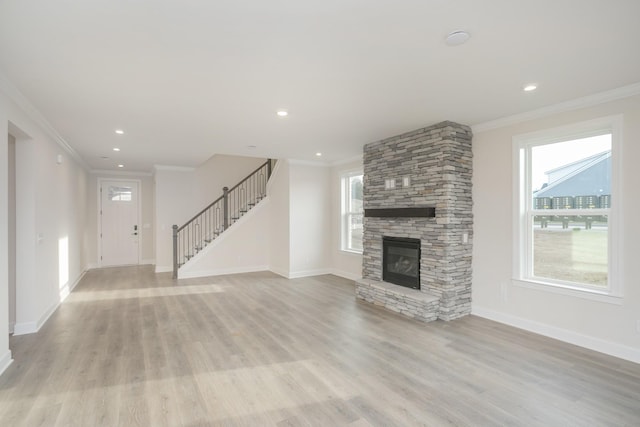 3294 Camden Ct, Mount Juliet, TN 37122 - unfurnished living room with ornamental molding, light wood-style floors, stairs, a fireplace, and recessed lighting