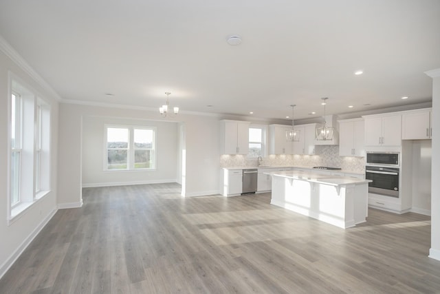 3294 Camden Ct, Mount Juliet, TN 37122 - kitchen featuring stainless steel appliances, a chandelier, light countertops, backsplash, and plenty of natural light