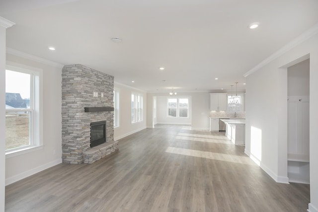 3294 Camden Ct, Mount Juliet, TN 37122 - unfurnished living room with crown molding, a fireplace, light wood-style flooring, and recessed lighting