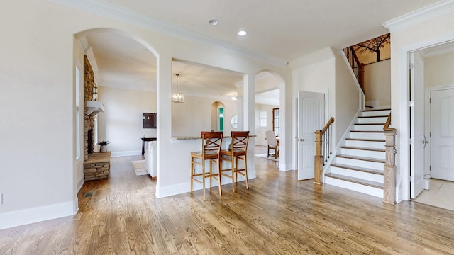 166 Azalea Ln, Franklin, TN 37064 - entryway featuring arched walkways, crown molding, stairs, light wood-style floors, and recessed lighting