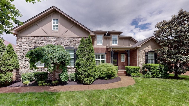 166 Azalea Ln, Franklin, TN 37064 - view of front facade with stone siding, stucco siding, and a front yard