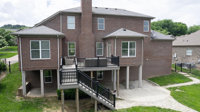 166 Azalea Ln, Franklin, TN 37064 - rear view of property featuring a patio, brick siding, a wooden deck, and a chimney