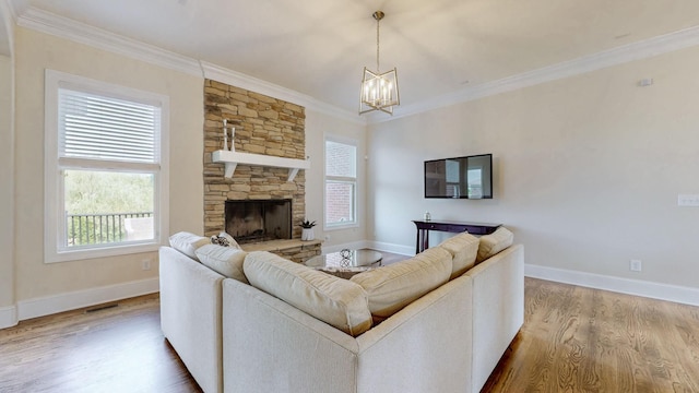 166 Azalea Ln, Franklin, TN 37064 - living room with wood finished floors, a chandelier, crown molding, and a fireplace