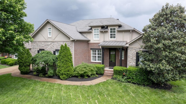 166 Azalea Ln, Franklin, TN 37064 - view of front of home featuring stucco siding, stone siding, and a front lawn