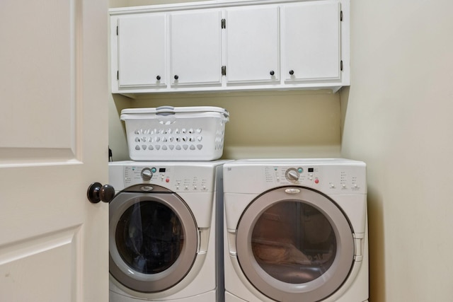 410 Ridge View Ct, Franklin, TN 37067 - laundry room featuring cabinet space and washing machine and clothes dryer