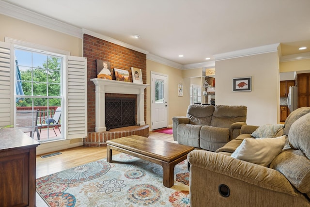410 Ridge View Ct, Franklin, TN 37067 - living room with crown molding, light wood-type flooring, recessed lighting, and a fireplace