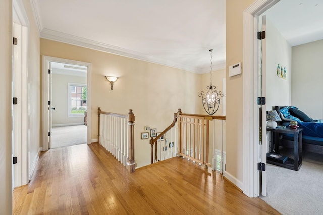 410 Ridge View Ct, Franklin, TN 37067 - hall featuring an upstairs landing, light wood-type flooring, a chandelier, and crown molding