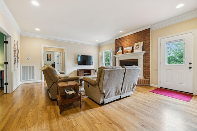 410 Ridge View Ct, Franklin, TN 37067 - living area with light wood finished floors, crown molding, recessed lighting, and a brick fireplace
