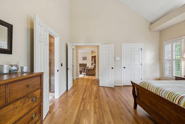 410 Ridge View Ct, Franklin, TN 37067 - bedroom with high vaulted ceiling and light wood-style flooring