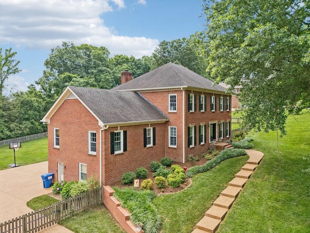 410 Ridge View Ct, Franklin, TN 37067 - view of side of home featuring brick siding, a chimney, roof with shingles, and concrete driveway