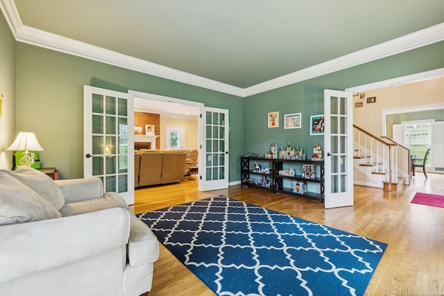 410 Ridge View Ct, Franklin, TN 37067 - living room featuring french doors, ornamental molding, wood finished floors, and stairs