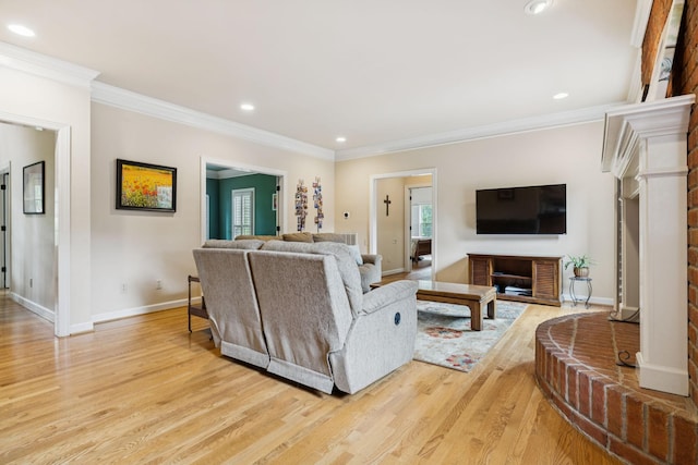 410 Ridge View Ct, Franklin, TN 37067 - living room featuring light wood-style floors, ornamental molding, plenty of natural light, recessed lighting, and a brick fireplace