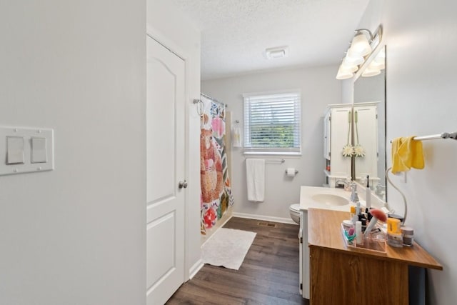 3448 Mahlon Moore Rd, Spring Hill, TN 37174 - bathroom featuring vanity, wood finished floors, a textured ceiling, and curtained shower