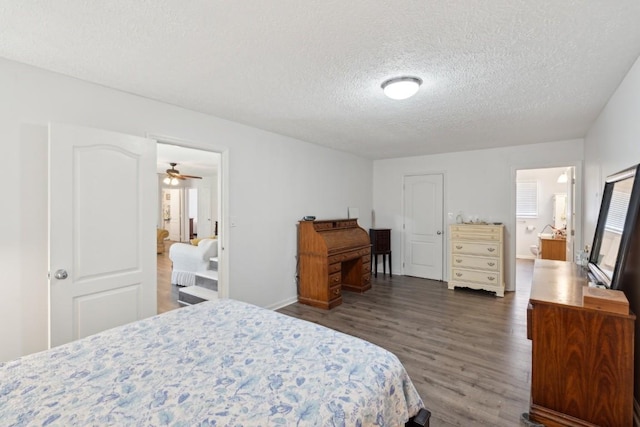 3448 Mahlon Moore Rd, Spring Hill, TN 37174 - bedroom featuring a textured ceiling, wood finished floors, and ensuite bathroom