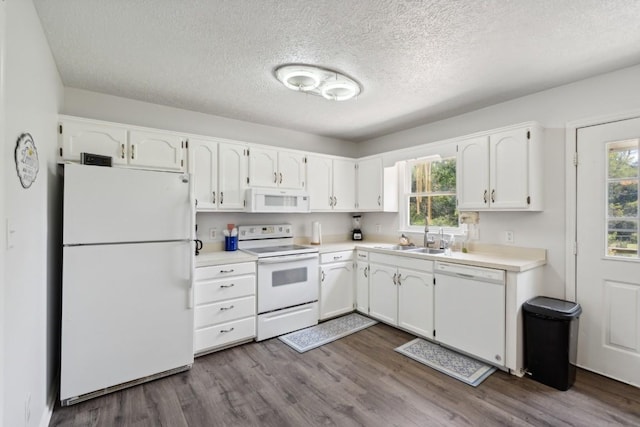 3448 Mahlon Moore Rd, Spring Hill, TN 37174 - kitchen with white appliances, white cabinets, a textured ceiling, dark wood finished floors, and light countertops