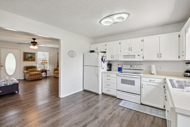 3448 Mahlon Moore Rd, Spring Hill, TN 37174 - kitchen with white appliances, white cabinetry, dark wood-style floors, a textured ceiling, and light countertops