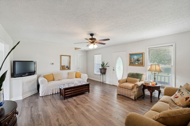 3448 Mahlon Moore Rd, Spring Hill, TN 37174 - living room featuring wood finished floors, a ceiling fan, and a textured ceiling