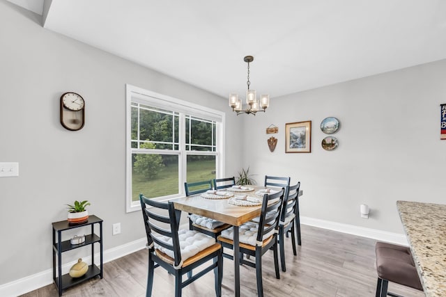 541 Macy Lynn Dr, Clarksville, TN 37042 - dining room with a chandelier and light wood-type flooring