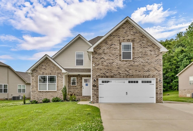 541 Macy Lynn Dr, Clarksville, TN 37042 - view of front of house with brick siding, driveway, an attached garage, and a front lawn