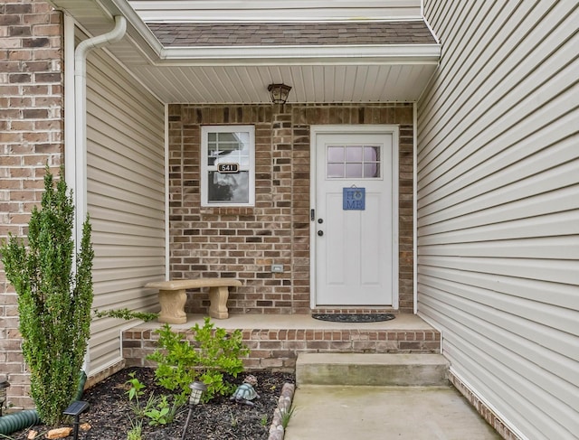 541 Macy Lynn Dr, Clarksville, TN 37042 - doorway to property featuring brick siding and roof with shingles