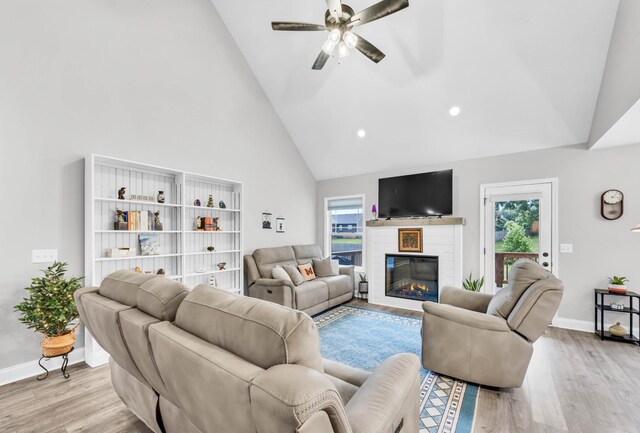 541 Macy Lynn Dr, Clarksville, TN 37042 - living area with wood finished floors, high vaulted ceiling, plenty of natural light, a ceiling fan, and recessed lighting